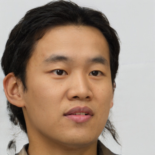 Neutral asian young-adult male with short  brown hair and brown eyes