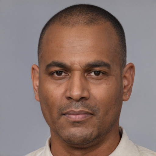Neutral latino adult male with short  black hair and brown eyes