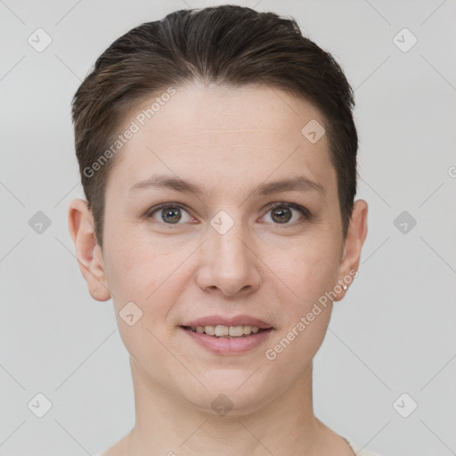 Joyful white young-adult female with short  brown hair and grey eyes