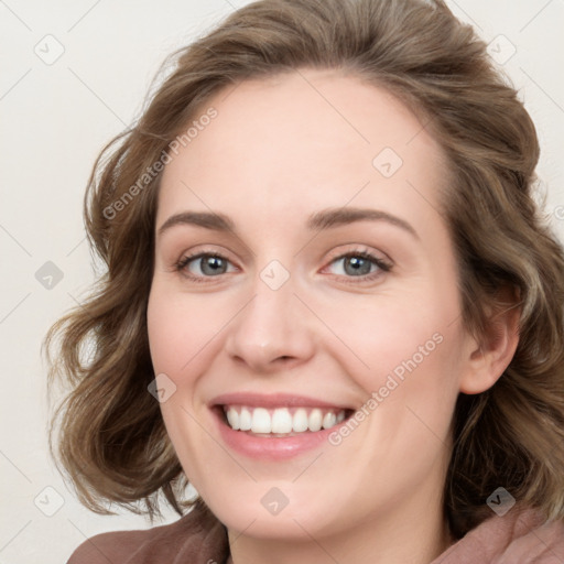 Joyful white young-adult female with medium  brown hair and blue eyes