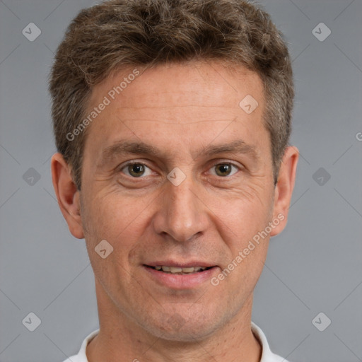 Joyful white adult male with short  brown hair and brown eyes
