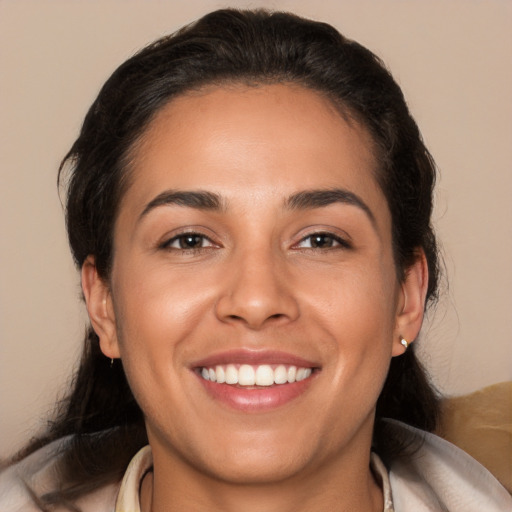 Joyful white young-adult female with long  brown hair and brown eyes