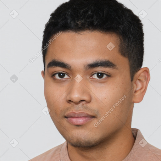 Neutral latino young-adult male with short  black hair and brown eyes