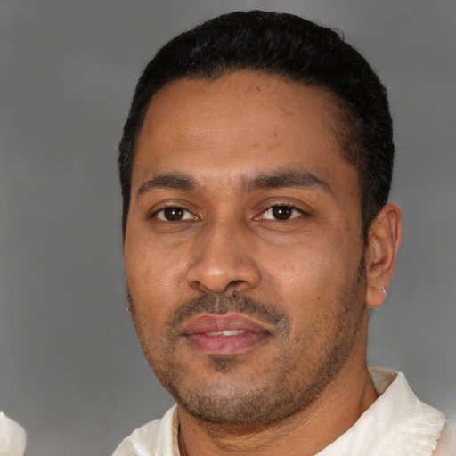 Neutral latino young-adult male with short  black hair and brown eyes