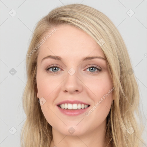 Joyful white young-adult female with long  brown hair and blue eyes