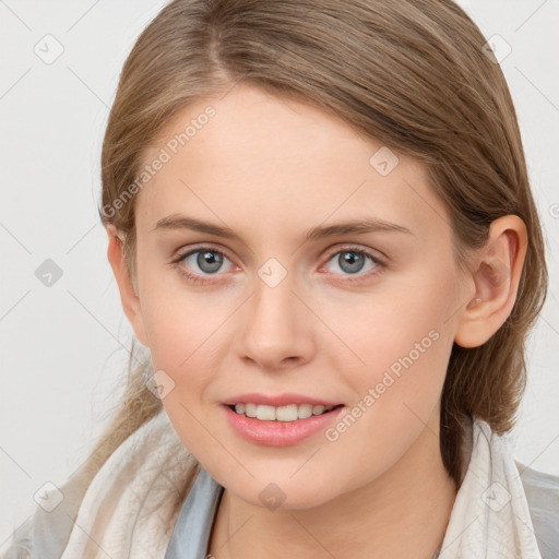 Joyful white young-adult female with medium  brown hair and blue eyes