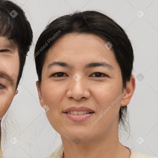 Joyful asian young-adult female with short  brown hair and brown eyes