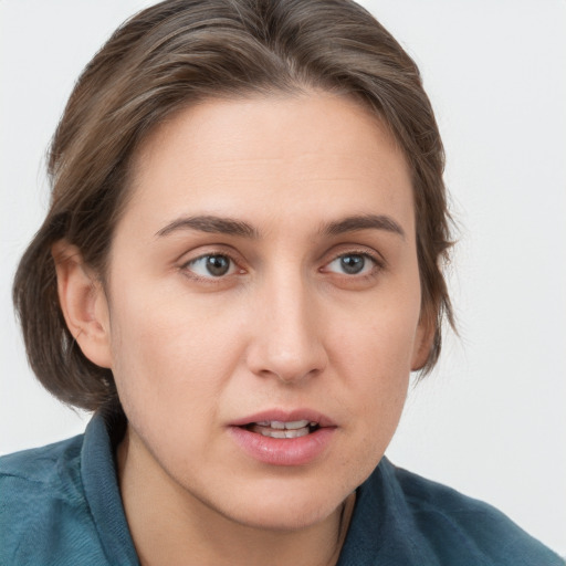 Neutral white young-adult female with medium  brown hair and grey eyes