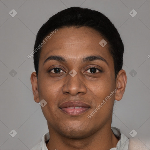 Joyful black young-adult female with short  black hair and brown eyes