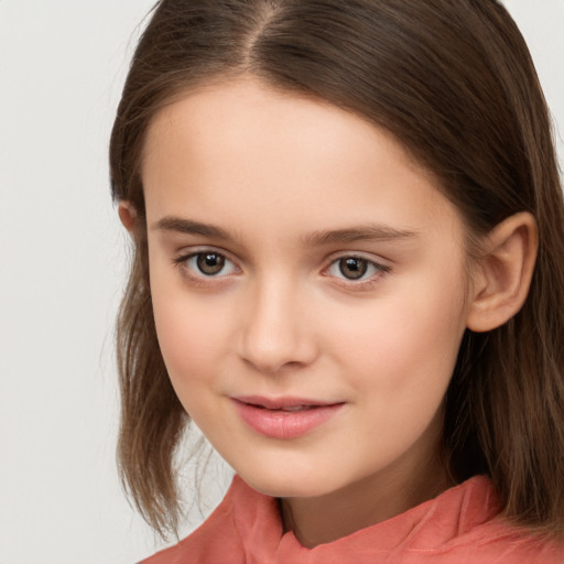 Joyful white child female with long  brown hair and brown eyes