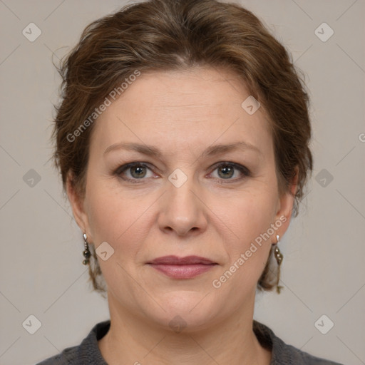 Joyful white adult female with medium  brown hair and grey eyes