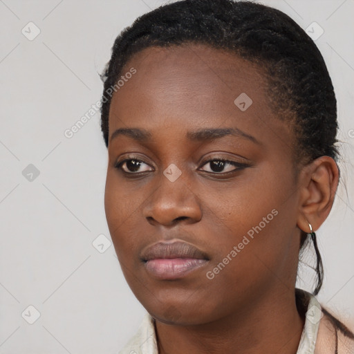 Neutral black young-adult female with long  brown hair and brown eyes