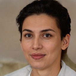 Joyful white adult female with short  brown hair and brown eyes