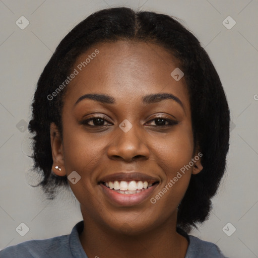 Joyful black young-adult female with medium  black hair and brown eyes