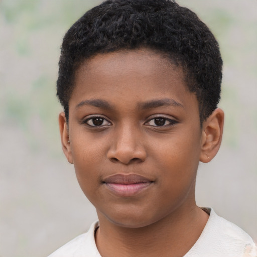 Joyful black child female with short  brown hair and brown eyes