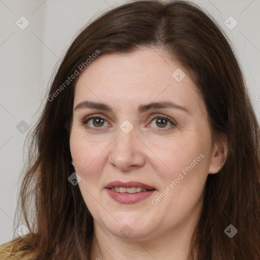 Joyful white adult female with long  brown hair and brown eyes