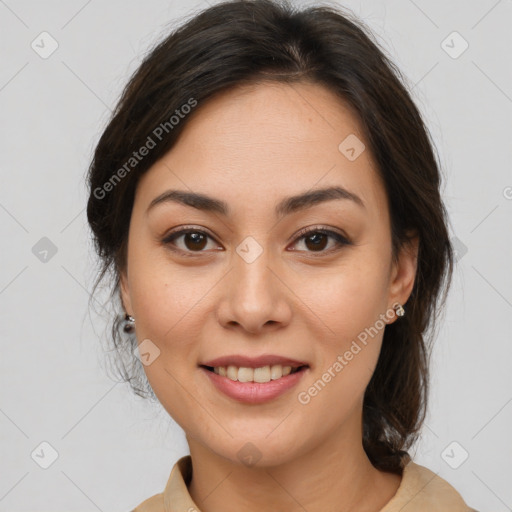 Joyful latino young-adult female with medium  brown hair and brown eyes