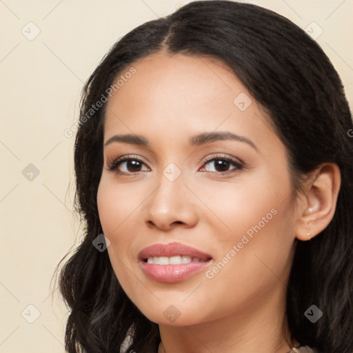 Joyful latino young-adult female with long  black hair and brown eyes