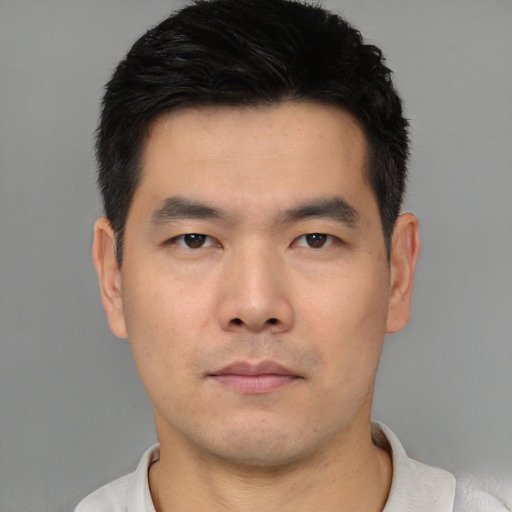 Neutral asian young-adult male with short  black hair and brown eyes