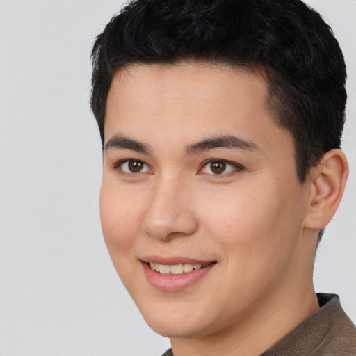 Joyful asian young-adult male with short  brown hair and brown eyes