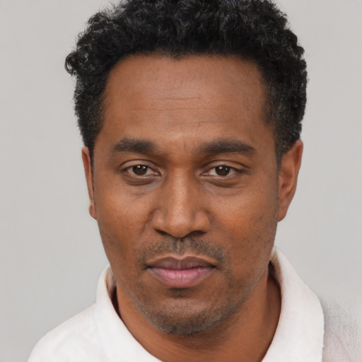 Neutral latino adult male with short  black hair and brown eyes