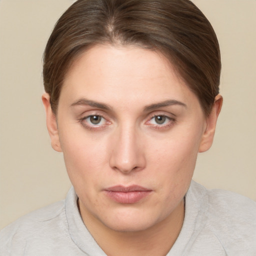 Neutral white young-adult female with short  brown hair and brown eyes