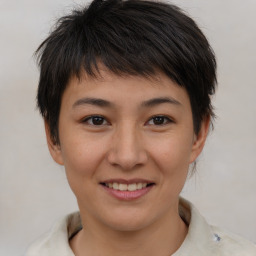 Joyful asian young-adult female with short  brown hair and brown eyes