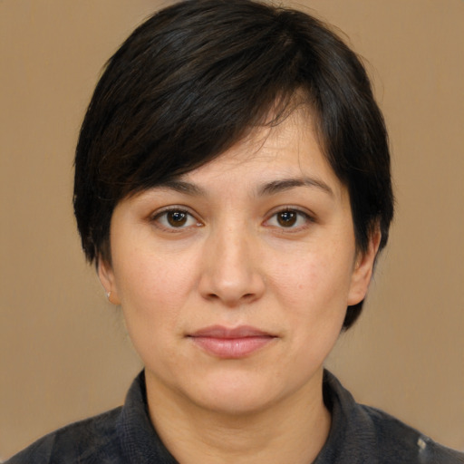 Joyful white adult female with medium  brown hair and brown eyes