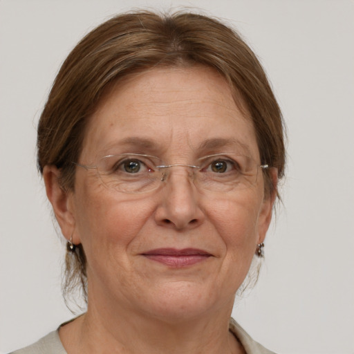 Joyful white middle-aged female with medium  brown hair and grey eyes