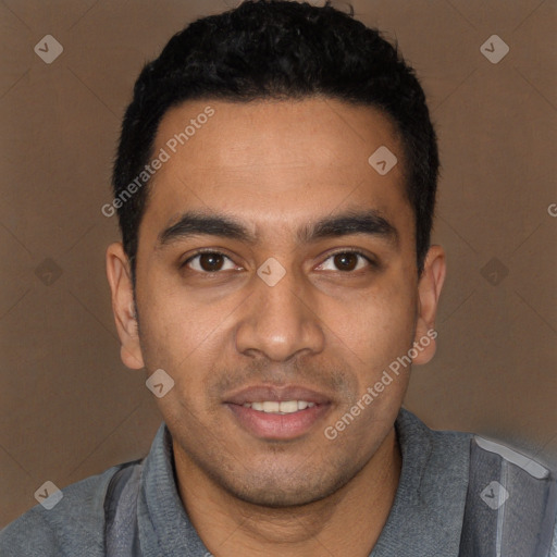 Joyful white young-adult male with short  black hair and brown eyes