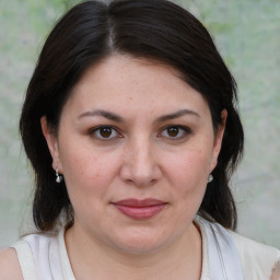 Joyful white adult female with medium  brown hair and brown eyes