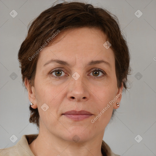 Joyful white adult female with medium  brown hair and grey eyes