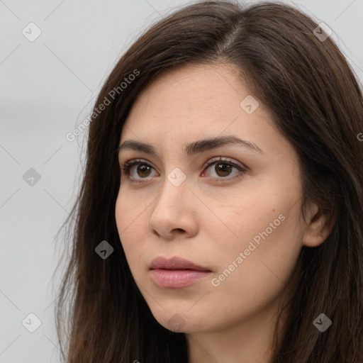 Neutral white young-adult female with long  brown hair and brown eyes