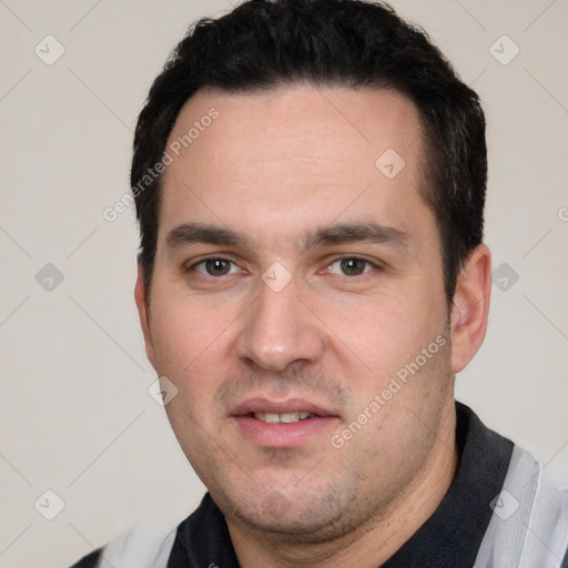 Joyful white young-adult male with short  black hair and brown eyes