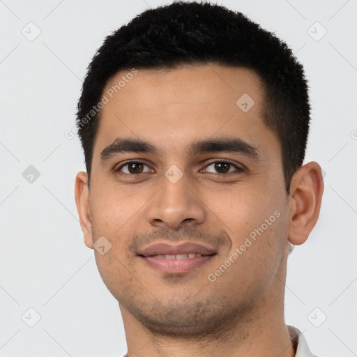 Joyful latino young-adult male with short  brown hair and brown eyes