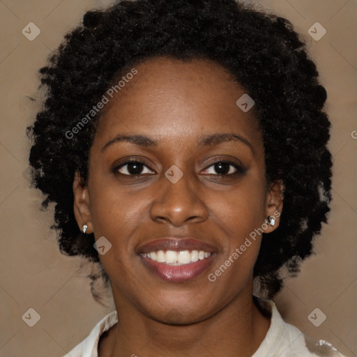 Joyful black young-adult female with medium  black hair and brown eyes