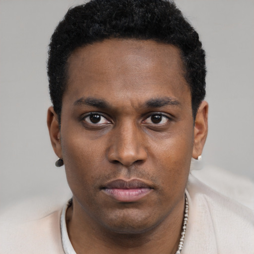 Neutral black young-adult male with short  black hair and brown eyes