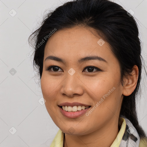 Joyful latino young-adult female with medium  brown hair and brown eyes