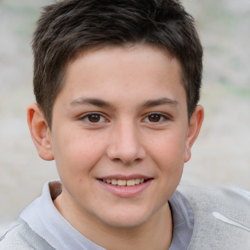 Joyful white child male with short  brown hair and brown eyes