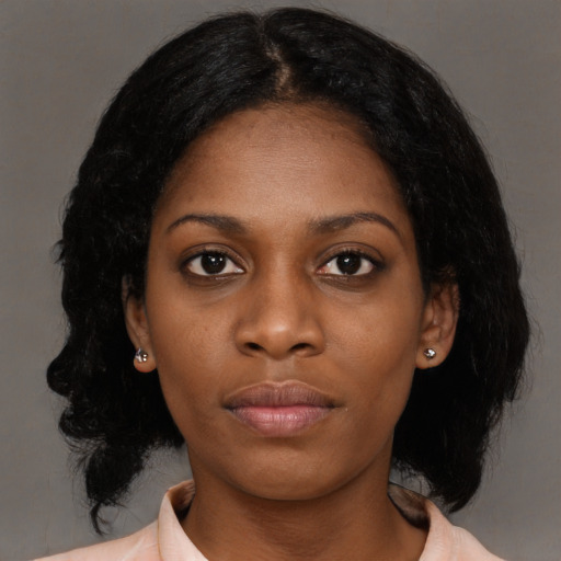 Neutral black young-adult female with medium  black hair and brown eyes