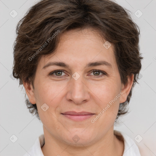 Joyful white adult female with short  brown hair and brown eyes