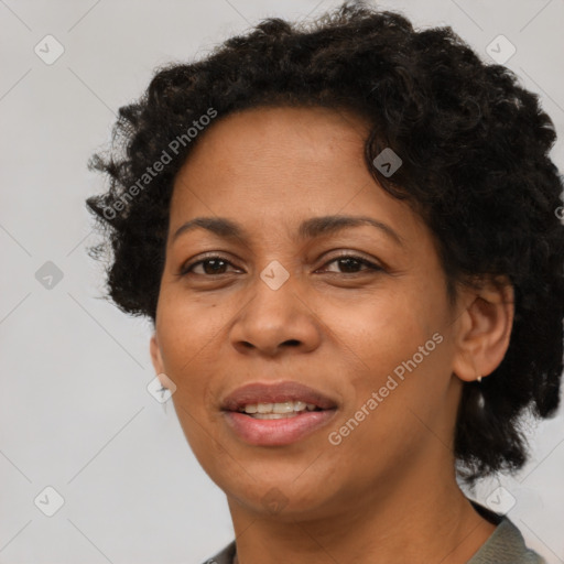 Joyful black adult female with short  brown hair and brown eyes