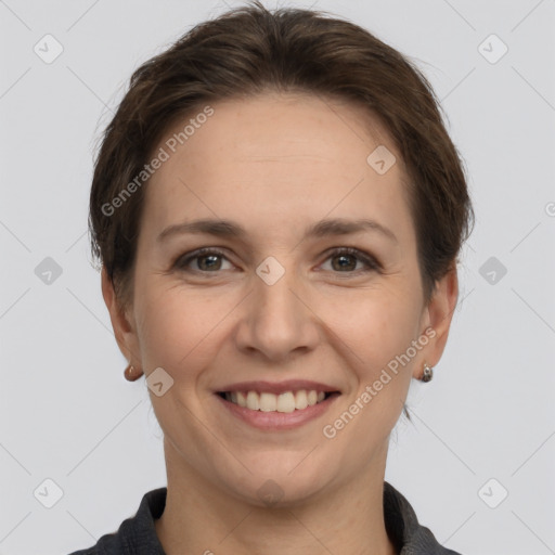 Joyful white adult female with short  brown hair and grey eyes