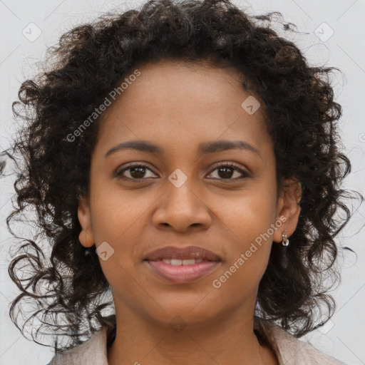 Joyful black young-adult female with long  brown hair and brown eyes