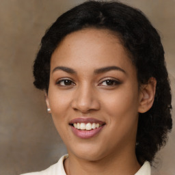 Joyful latino young-adult female with medium  black hair and brown eyes