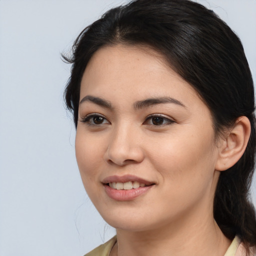 Joyful asian young-adult female with medium  brown hair and brown eyes