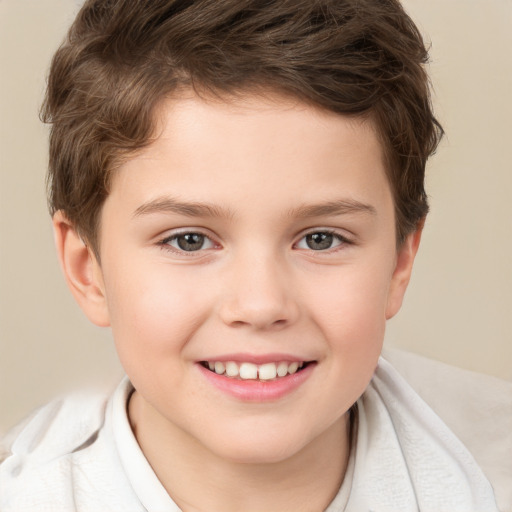 Joyful white child male with short  brown hair and brown eyes