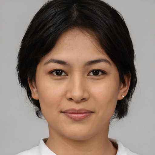 Joyful asian young-adult female with medium  brown hair and brown eyes