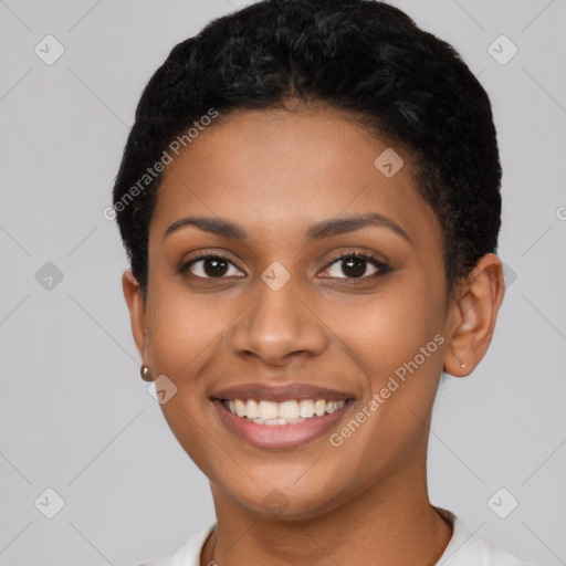 Joyful latino young-adult female with short  black hair and brown eyes