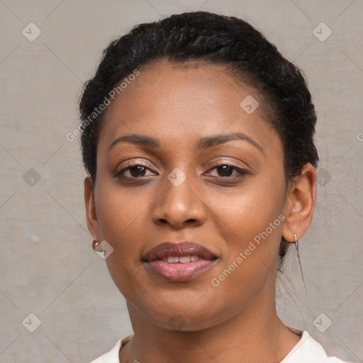 Joyful black young-adult female with short  black hair and brown eyes